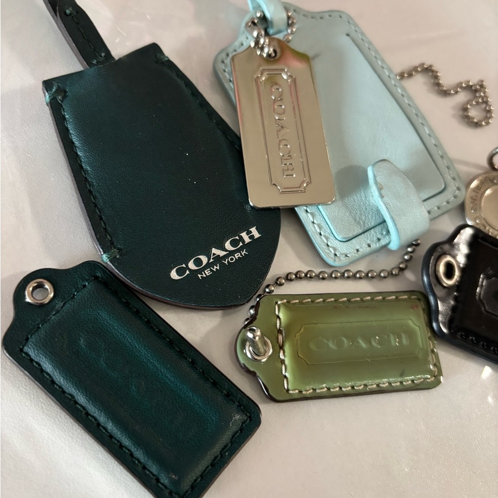 Coach Leather Tag Collection in Green, Black, and Light Blue with Silver Accents